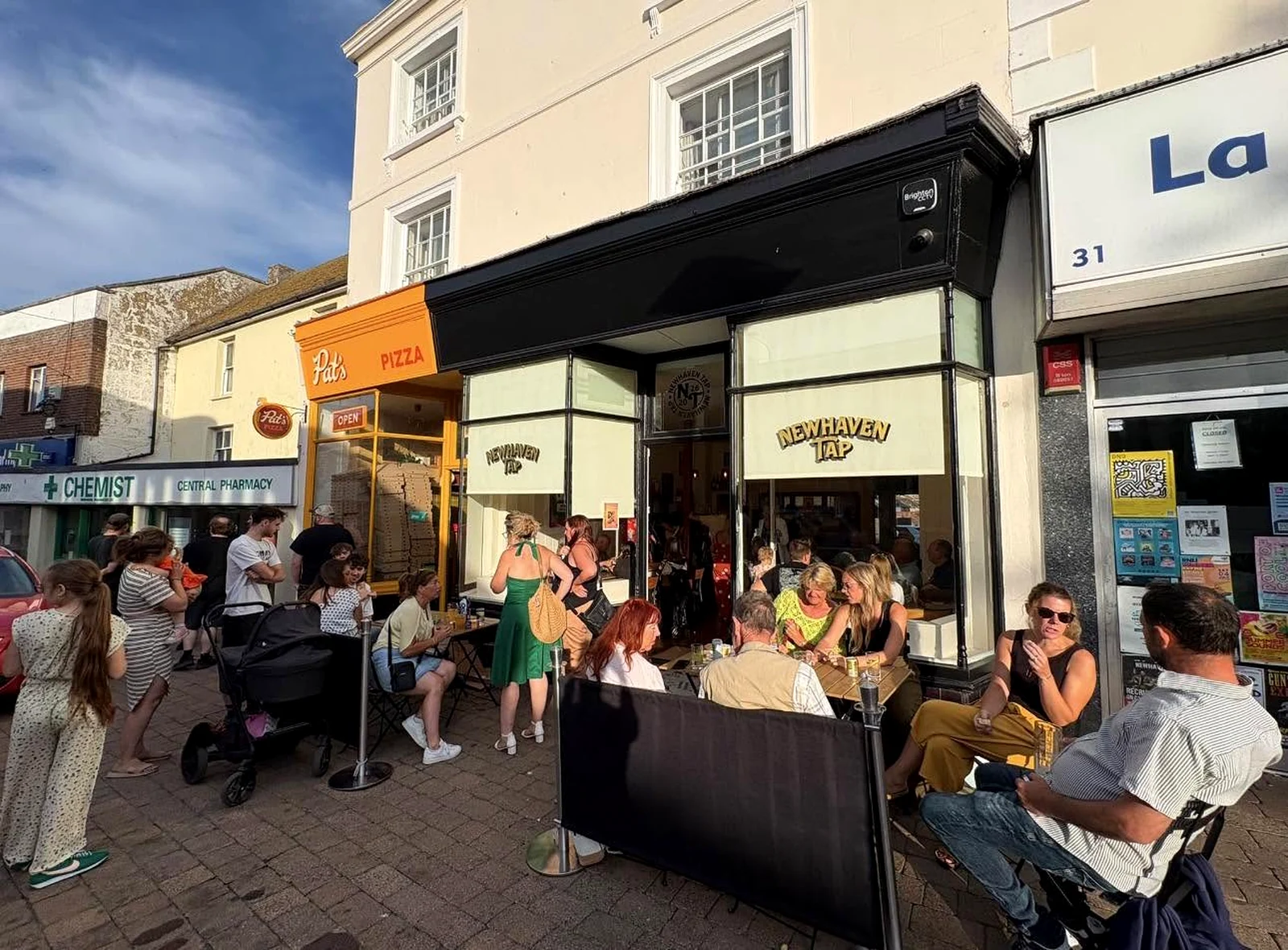 Busy High Street atmosphere outside Newhaven Tap