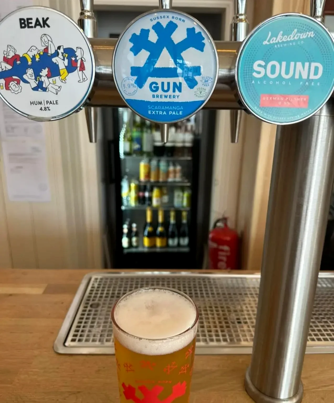 Pint and beer pumps at Newhaven Tap